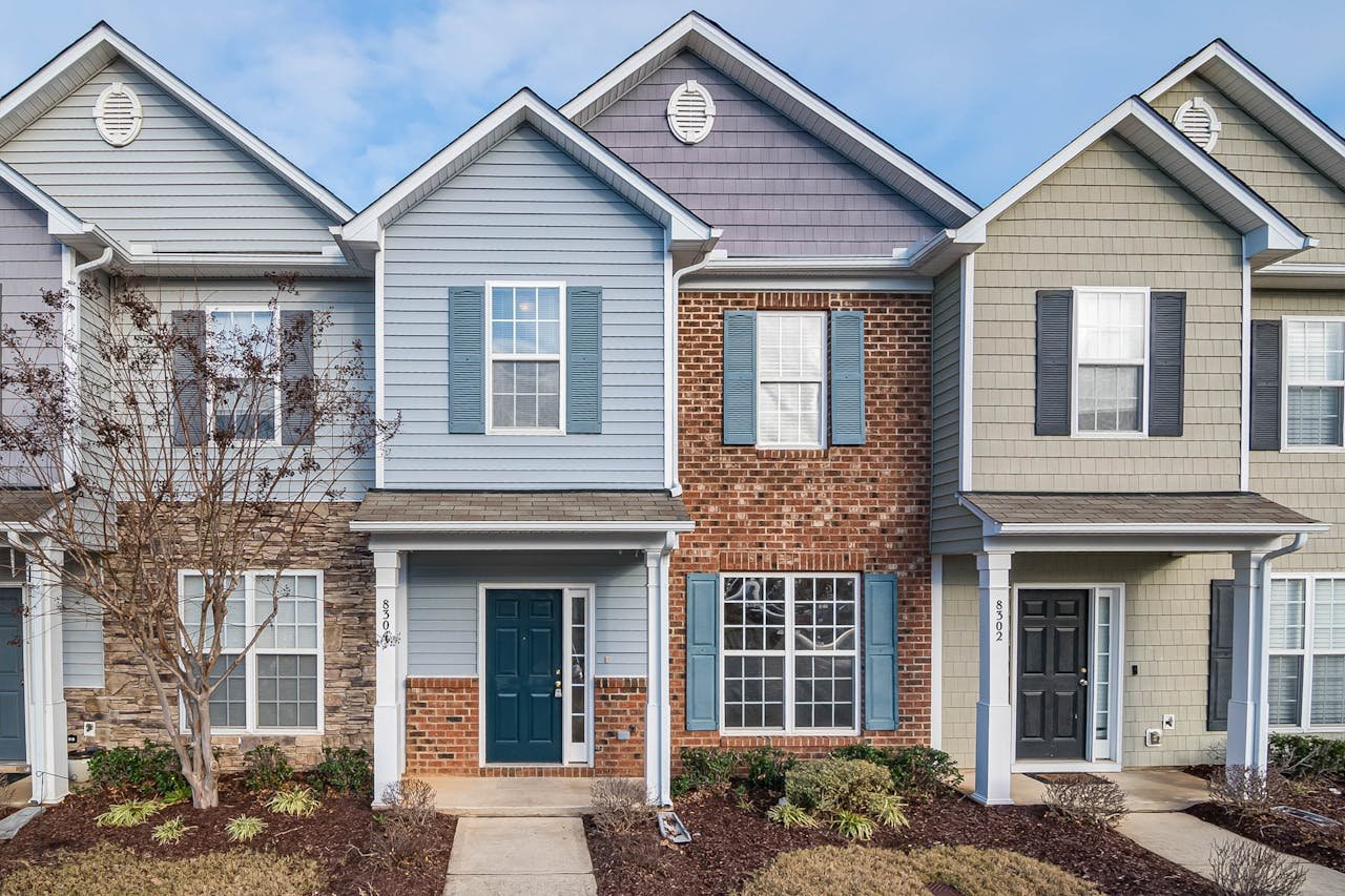 Elegant view of suburban townhouses showcasing diverse architectural styles.
